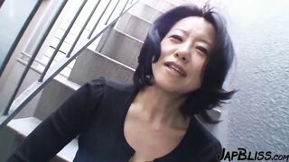 Mature Japanese Beauty Enjoys an Intimate Moment After Passionate Encounter