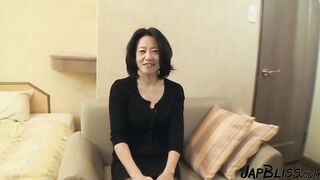 Mature Japanese Beauty Enjoys an Intimate Moment After Passionate Encounter