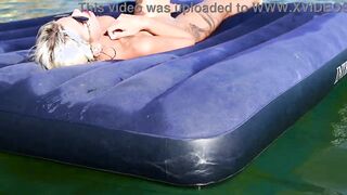 Curious Beach Day: Watch as a Stunning Blonde Enjoys the Sun with Dolphins Nearby!