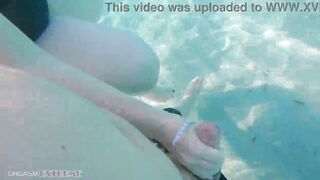 Chubby girlfriend enjoys underwater fun with her boyfriend, giving a footjob and flaunting her big boobs.
